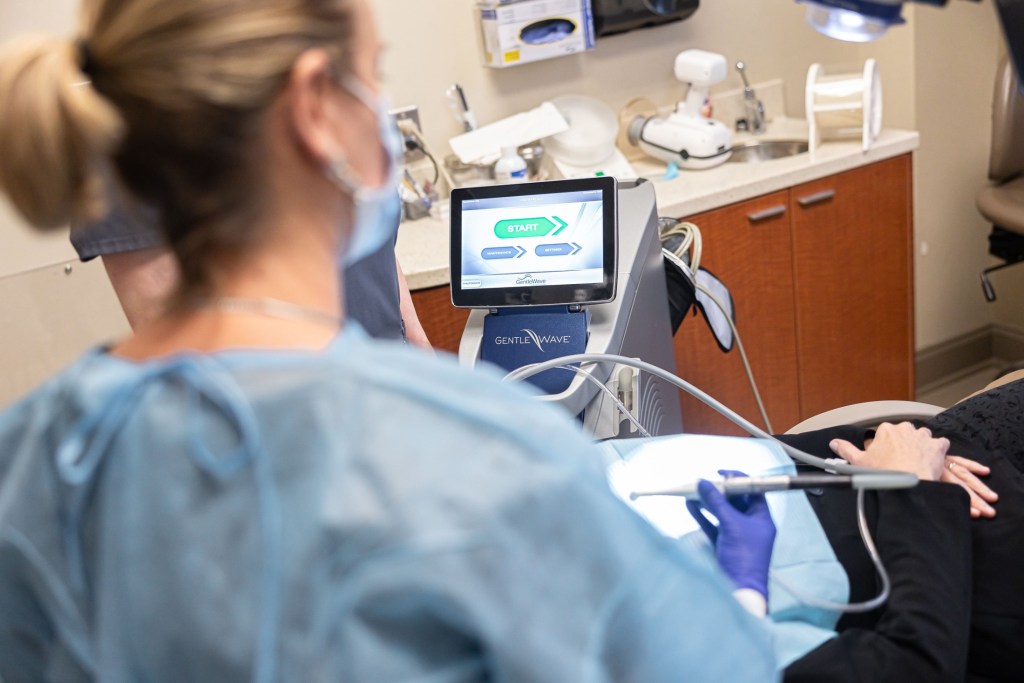 Woman using dental technology